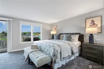 Top floor: Spacious primary bedroom with large windows and peaceful views