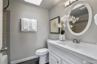 Bright full bath with skylight, bringing in natural light all day long