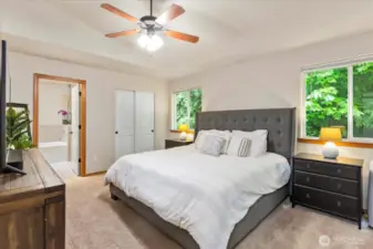 Upstairs Primary Suite with vaulted ceilings & fan