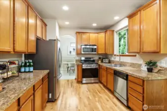 Granite slab counters, pretty oak hardwoods, tons of counter top space.