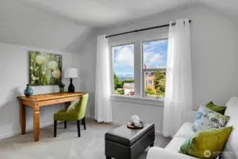 Upstairs primary suite retreat with sitting room or office.  Tax records call this bedroom #4 if you decide to put in a wall.