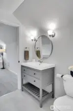 New vanity, sconce lighting & flooring in the primary suite 3/4 bath. Expand the shower & you will have it all!