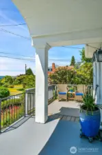 Front porch with arched beadbord detail and deck extension. Your own front row seat to fabulous summer sunsets.
