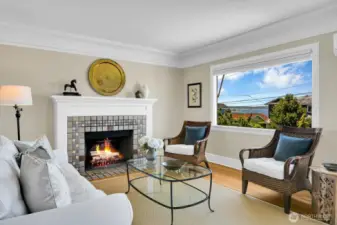 Grand coffered ceilings, original trim & hardwoods in the generous living room & dining room.