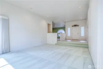 Living room view to entry and dining room