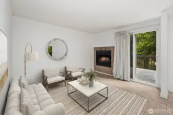 Virtually staged multi-purpose room. Staged as an additional living room, but could also function as a dining room. Gas fireplace to the left of sliding door access to the back deck.