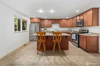 Kitchen with an eat-in island. View from the multi-purpose living room or dining room.