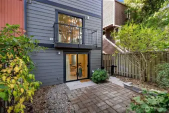 Two levels of the home open to the private backyard.