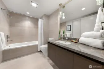 Large bathroom with shower and tub.