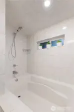 Great soaking tub and shower, fully tiled.