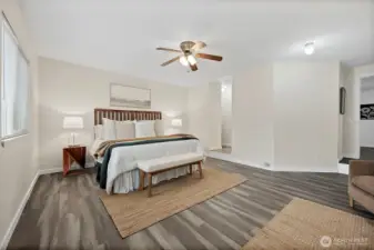 Cozy primary with step down from main hallway (converted from a garage), and set up into the closet and en-euite bathroom.