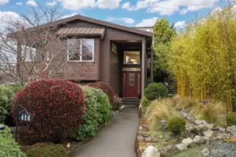 There is a welcoming and defined entry from the street, surrounded by incredible landscape.