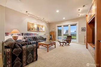 The family room is very large and opens to the covered patio that actually has bay and island views!