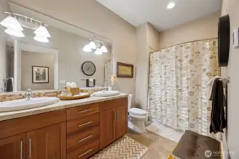 The full bath on the lower level also has the travertine tile and a large dual sink vanity. This is the only room that does not have a bay view!