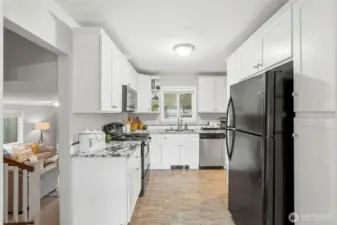 The beautifully updated kitchen serves as the heart of the home, combining style and functionality in a space designed for everyday living.