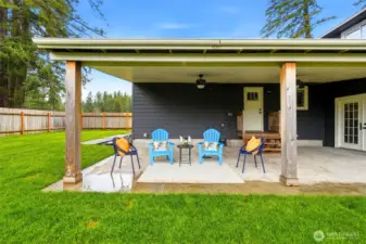 Huge covered patio with ceiling fans overlooking the newly landscaped yard—perfect for summer evenings and weekend gatherings.