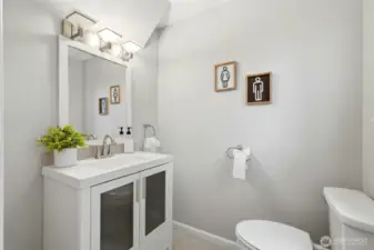 The home features two full bathrooms and a convenient half bath, all thoughtfully updated during the renovation. Modern finishes and fixtures give each bathroom a clean, polished look.