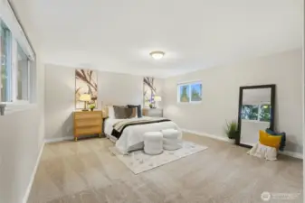 Two additional bedrooms offer flexibility for a variety of living needs. These rooms are spacious enough to comfortably accommodate guests, home office setups, or growing households.