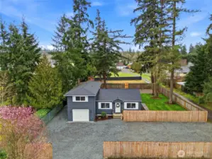 Set on more than half an acre of flat, usable land, the property offers exceptional outdoor potential.