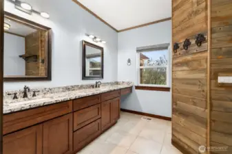 Primary bath includes a walk in full tile shower & dual sinks.