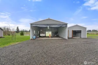 Covered RV storage with sewage hookup and 220amp.