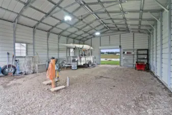 RV Parking with drive through garage door in rear.