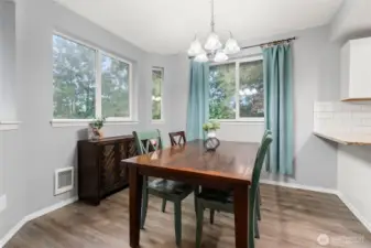 The cozy dining nook is perfect and ties the kitchen and living room together!
