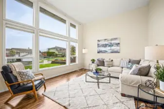 Floor to ceiling windows provide a beautiful view in the formal living room.
