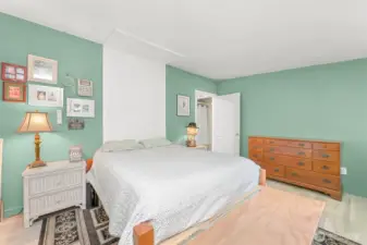 Comfortable primary bedroom with ample space for furnishings and convenient access to adjacent bath.”