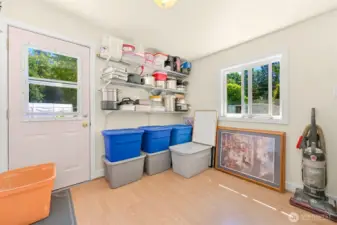 Versatile second bedroom ideal for guests, office, or additional storage, with built-in shelving and natural light.