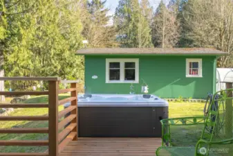 A detached outbuilding offers flexible use as a shop, studio, or additional space