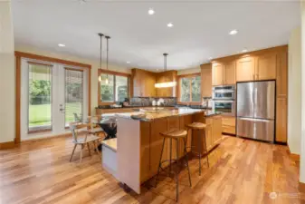 This stunning kitchen is a culinary delight. Offering top of the line stainless appliances , granite counter,cusom cabinets and built in banquet for dining.
