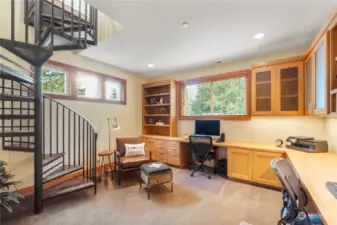 Functional and elegant you will have a superior space to work from home in this office. Tip toe up the spiral staircase to a secret hide away.