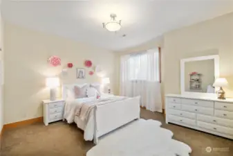 One of three spacious bedrooms located on upper level.