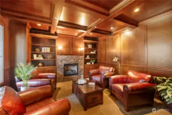 This one of a kind sitting room is stately. Leather club chairs welcome you to sit and read a great book in front of the fire or sip on your favorite beverage.