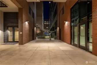 Breezeway leading to building entry, parking garage Il Terrazzo Carmine and business access