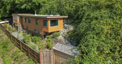 Drone view of Main (south) home and terraced side yard and garden shed.