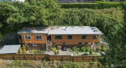 Drone view of both homes on 1 lot:  On the right:  Main (south) home and on the left:  Cottage (south) home