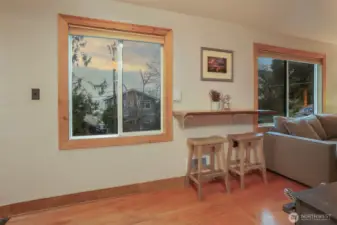 Main (South) home upper level custom built eating bar between living room and kitchen.