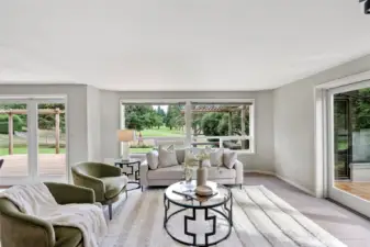 Informal dining space with deck/backyard access and entrance to the sunroom.