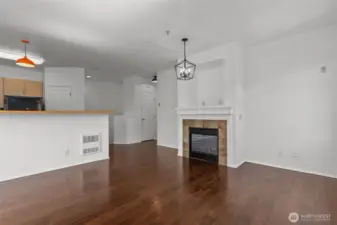 Bright open living room with vaulted ceilings, skylights, and cozy gas fireplace