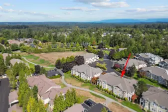 Resort-style amenities including outdoor pool, clubhouse, gym, and walking trails