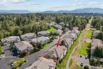 Resort-style amenities including outdoor pool, clubhouse, gym, and walking trails