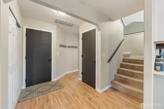 Looking from Family Room: Door to Garage, Hallway to Living room, Stairs to 2nd floor