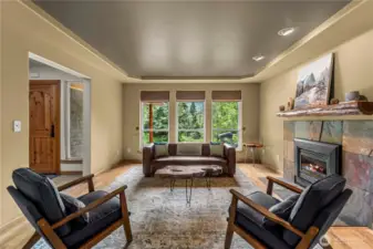 A wall of windows frames mountain views while the gas fireplace sets the mood - invites slow mornings, relaxed evenings, and quiet moments surrounded by handcrafted charm.