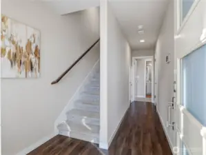 Enter on first floor to find bedroom, ensuite bath and 2 car garage