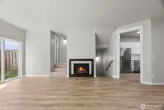 Downstairs to the 2-car garage, new furnace, W/D hook-up & new water heater. Left of the FP, 3-steps up to the half-bath then upstairs to two bedrooms, each with full bath. Slider to the left out to private deck.