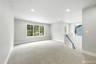 Head upstairs into the Bonus Room - photos of same plan built on a different lot. Details will vary