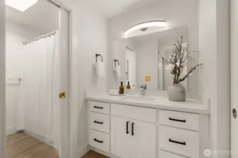 Vanity space in primary is next to the walk through closet. So much space for your toiletries to be tucked away.