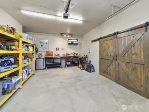 One of the 4 garage bays currently being used as a shop.